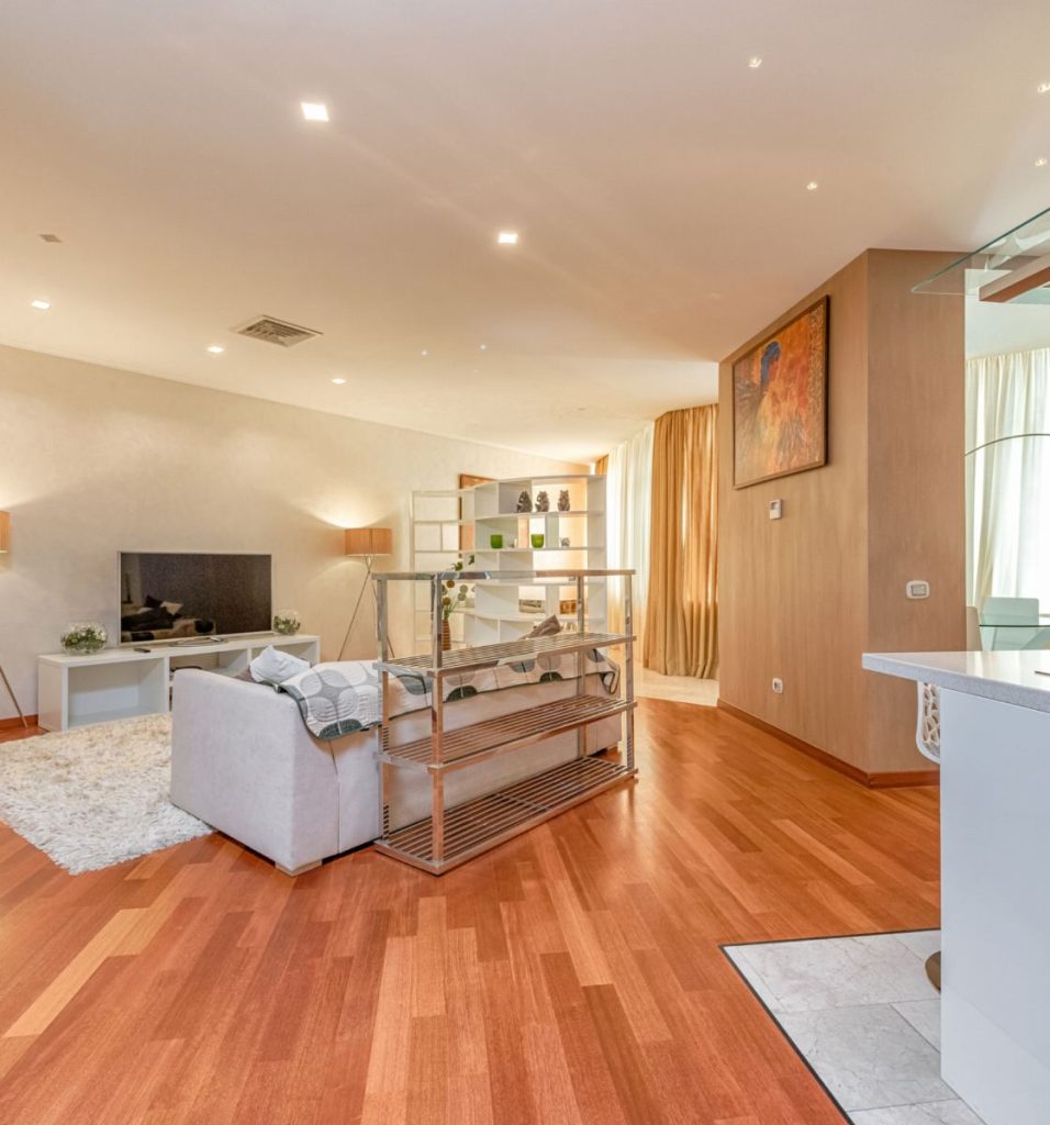 A living room with an open kitchen