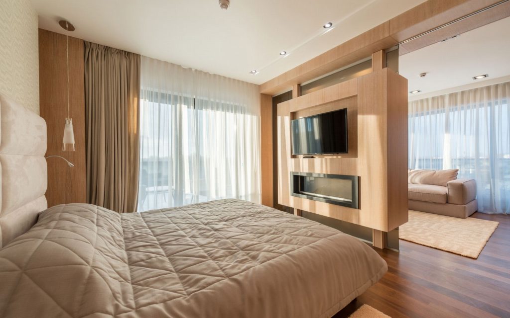 A bright studio with a bed and living area